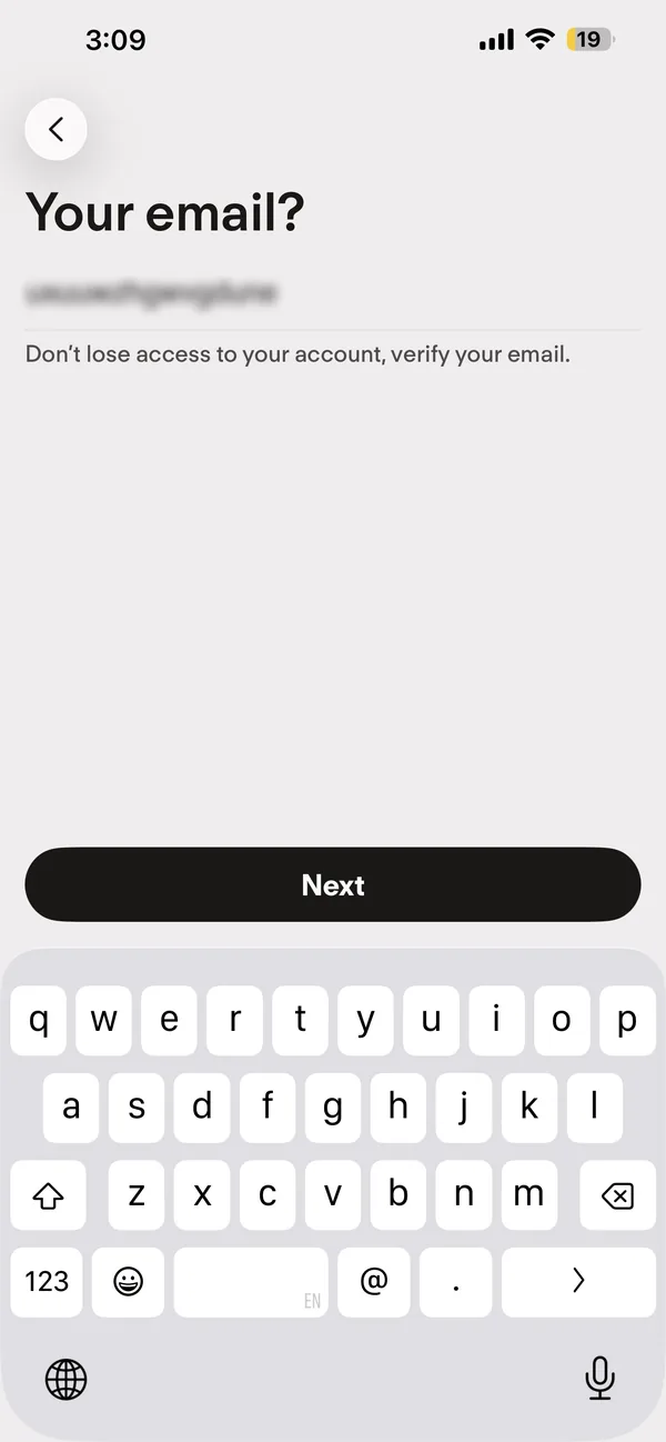 Tinder sign-up screen asking for an email address, with the address blurred